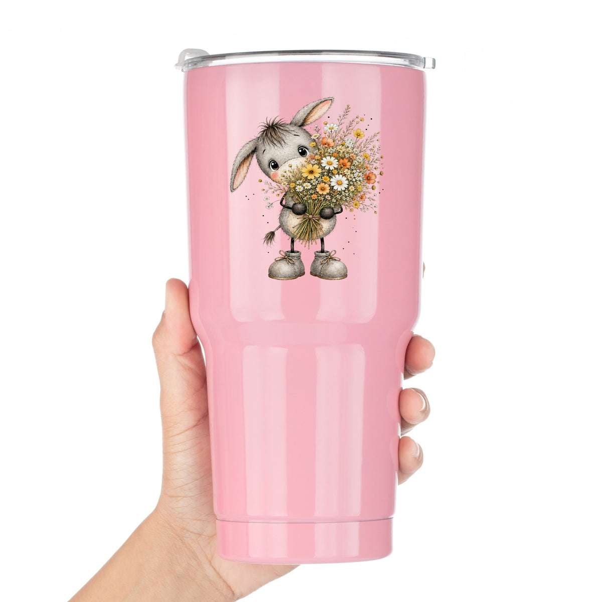 Baby Donkey Holding Wildflower Bouquet UV DTF sticker applied to a pink tumbler held against a white background