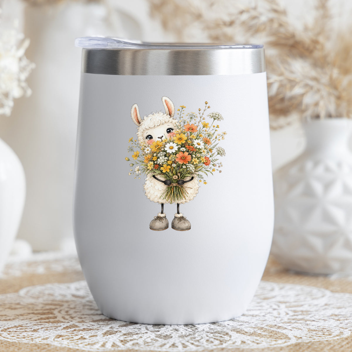 White Llama Holding Daisy Bouquet UV DTF sticker applied to a white stemless tumbler with a lid