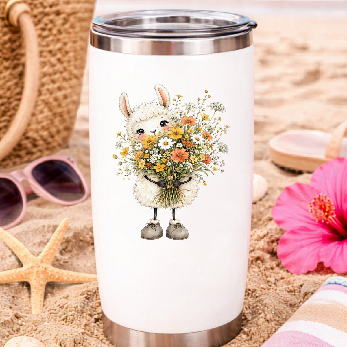 White Llama Holding Daisy Bouquet UV DTF sticker applied to a white travel tumbler on beach sand