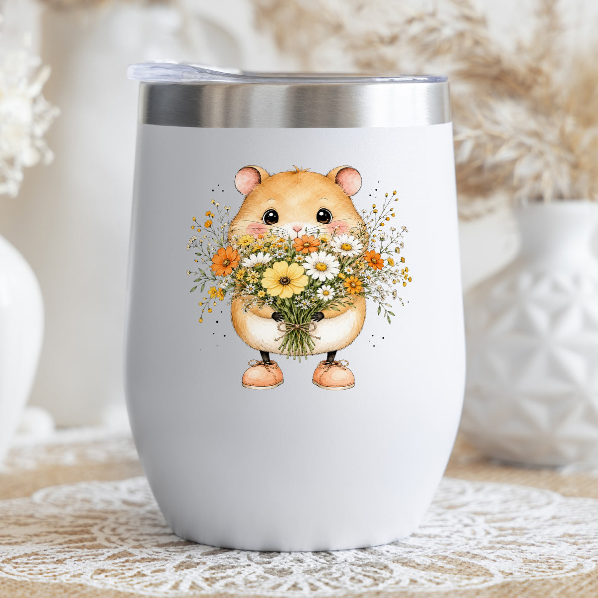 Hamster Holding Wildflower Bouquet UV DTF sticker applied to a white stemless tumbler with a lid