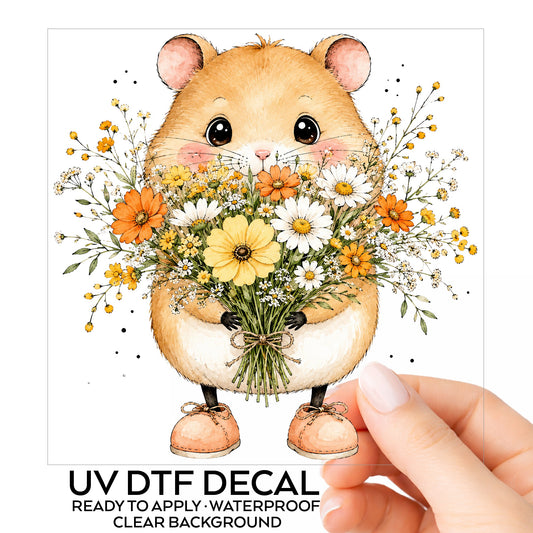 Hamster Holding Wildflower Bouquet UV DTF sticker on its backing card, held in hand