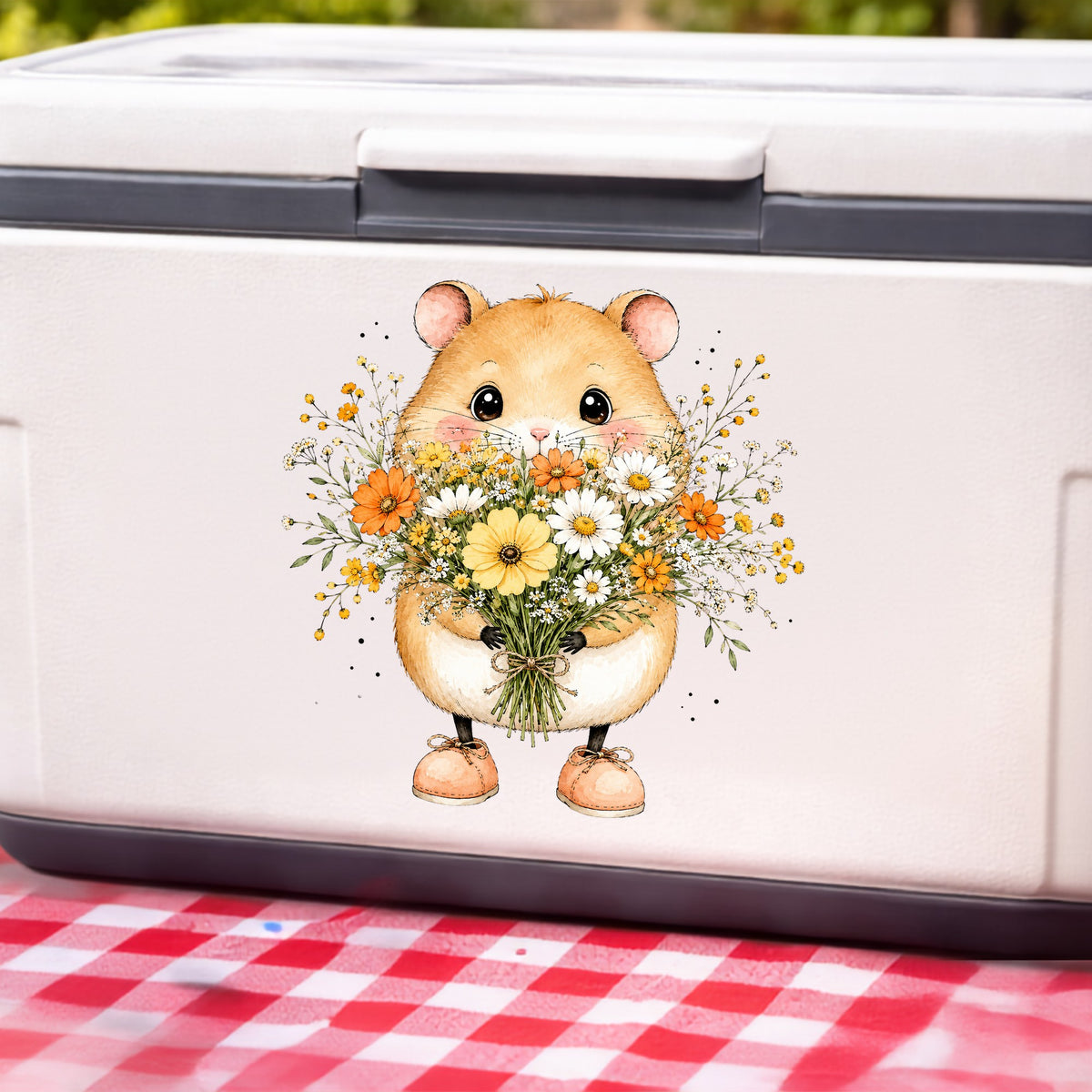 Hamster Holding Wildflower Bouquet UV DTF sticker applied to a white cooler on a red gingham cloth