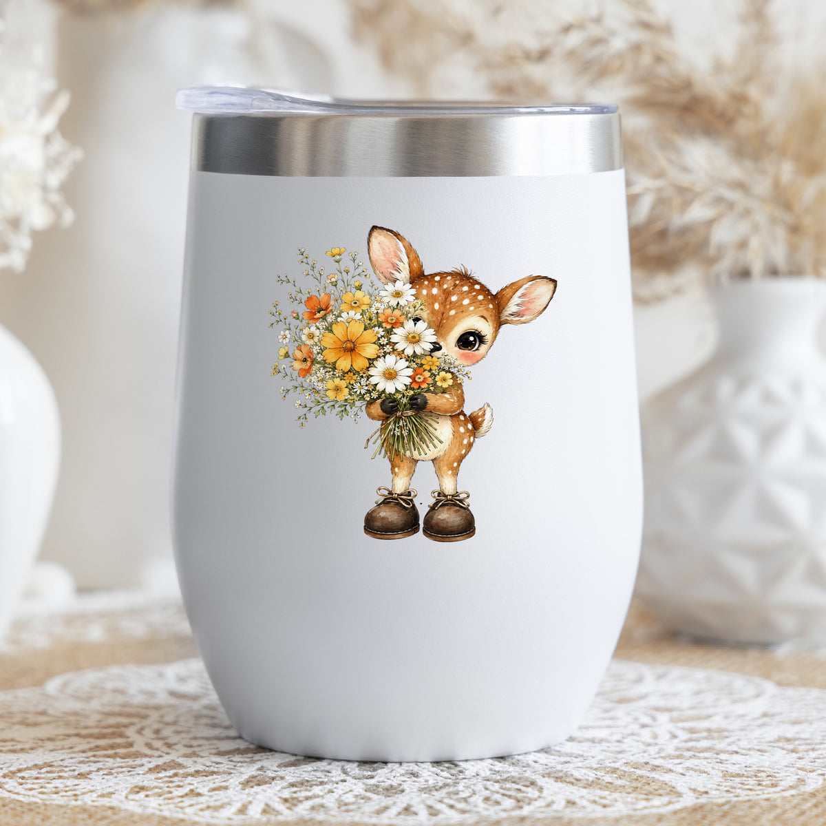 Baby Deer Holding Wildflower Bouquet UV DTF sticker applied to a white stemless tumbler with a lid
