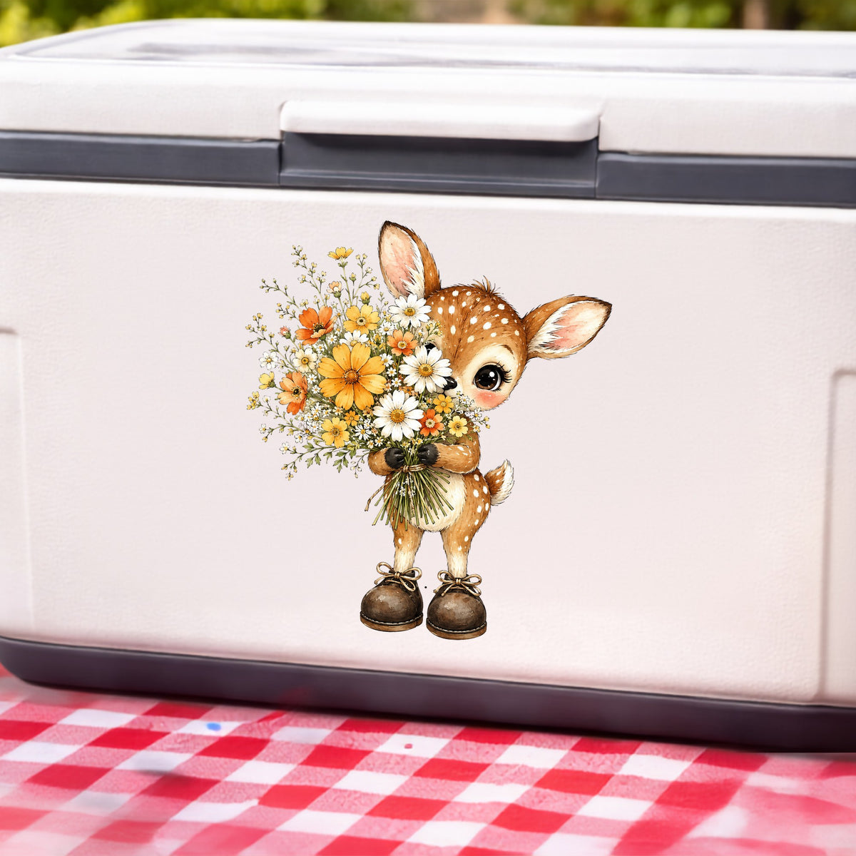 Baby Deer Holding Wildflower Bouquet UV DTF sticker applied to a white cooler on a red gingham cloth
