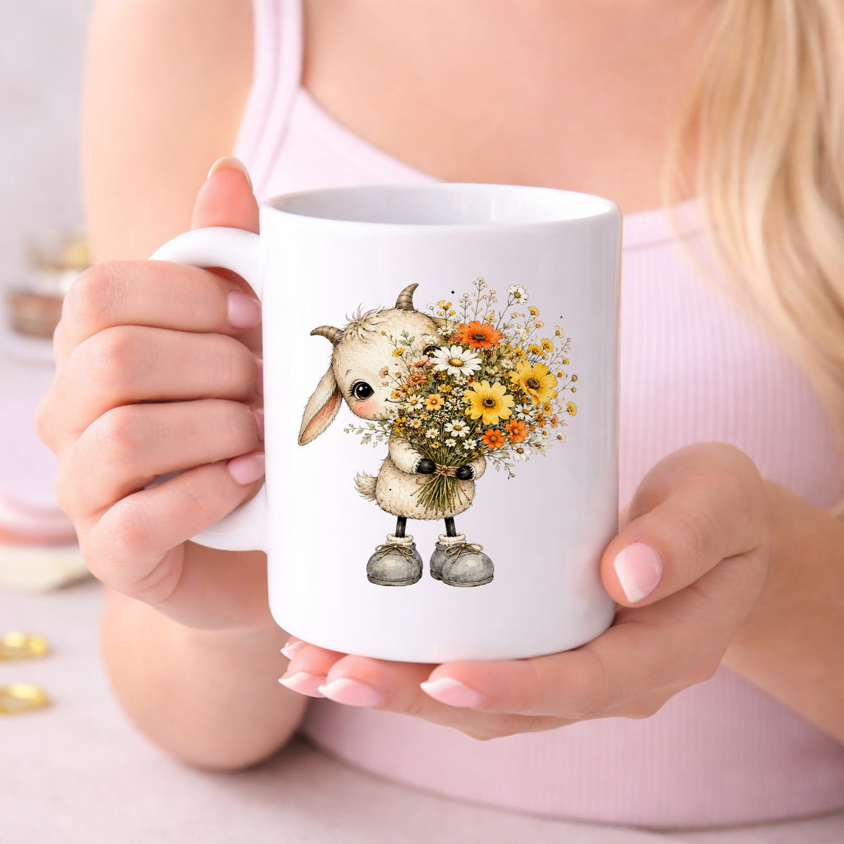 Baby Goat Holding Wildflower Bouquet UV DTF sticker applied to a white coffee mug held in both hands