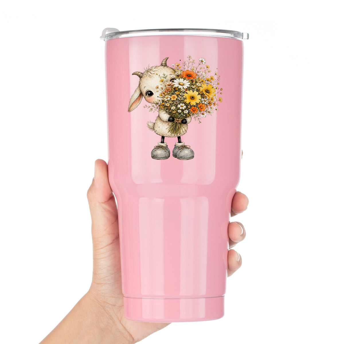 Baby Goat Holding Wildflower Bouquet UV DTF sticker applied to a pink tumbler held against a white background