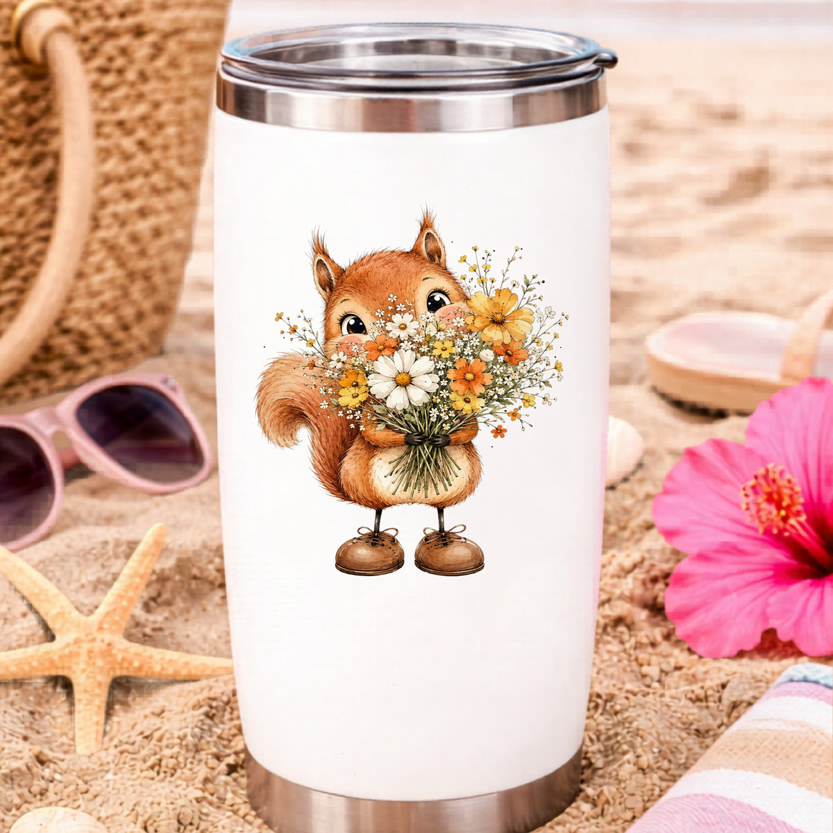 Red Squirrel Holding Daisy Bouquet UV DTF sticker applied to a white travel tumbler on beach sand