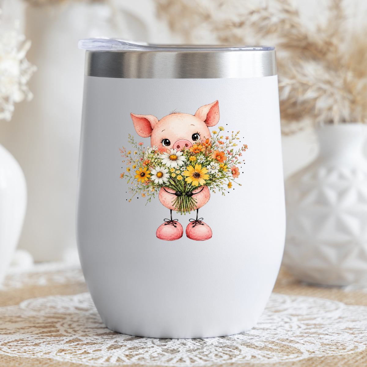 Baby Pig Holding Daisy Bouquet UV DTF sticker applied to a white stemless tumbler with a lid