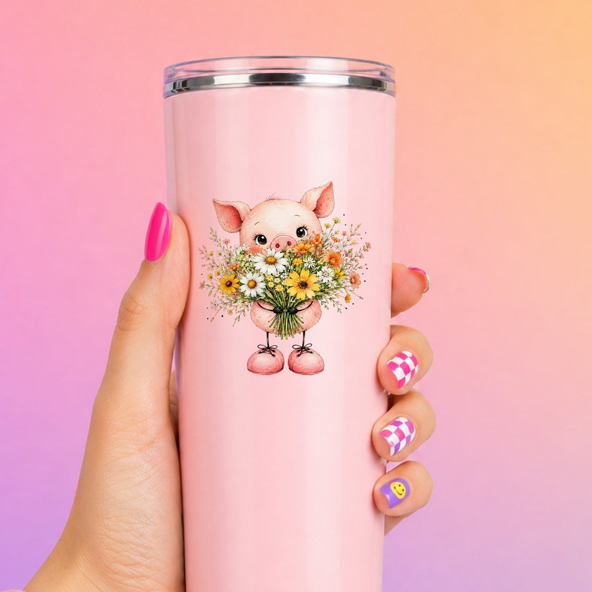 Baby Pig Holding Daisy Bouquet UV DTF sticker applied to a tall pink tumbler on a pink and orange background