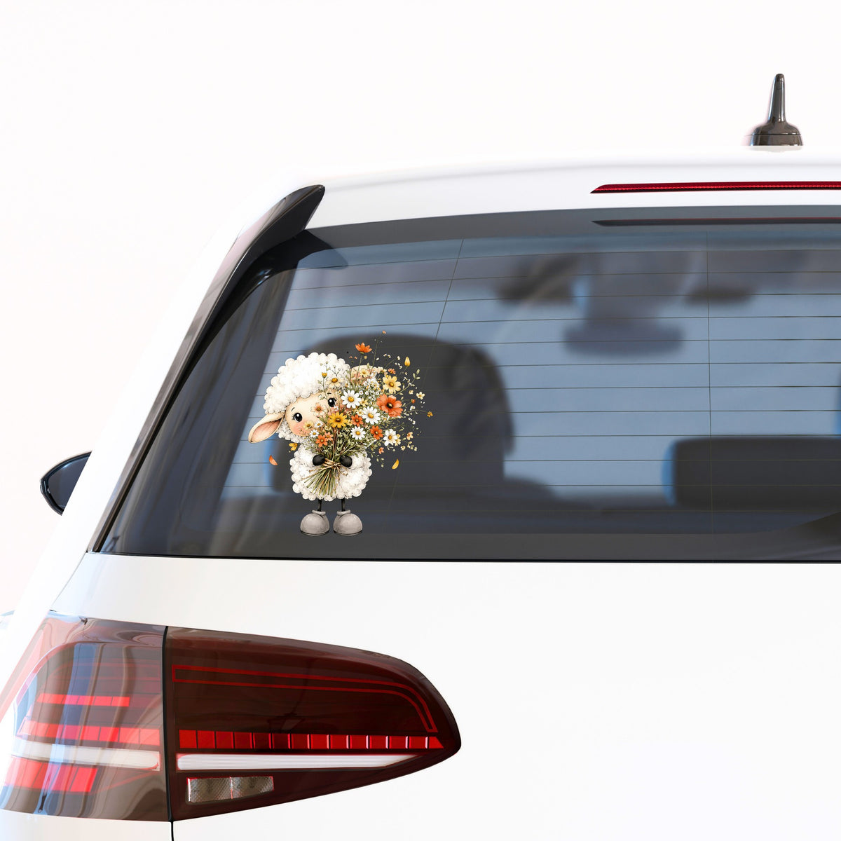 White Lamb Holding Wildflower Bouquet UV DTF sticker applied to the rear window of a white car