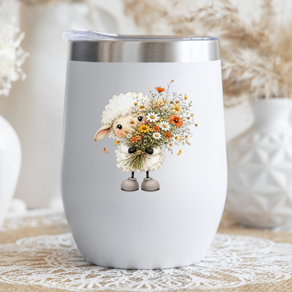 White Lamb Holding Wildflower Bouquet UV DTF sticker applied to a white stemless tumbler with a lid