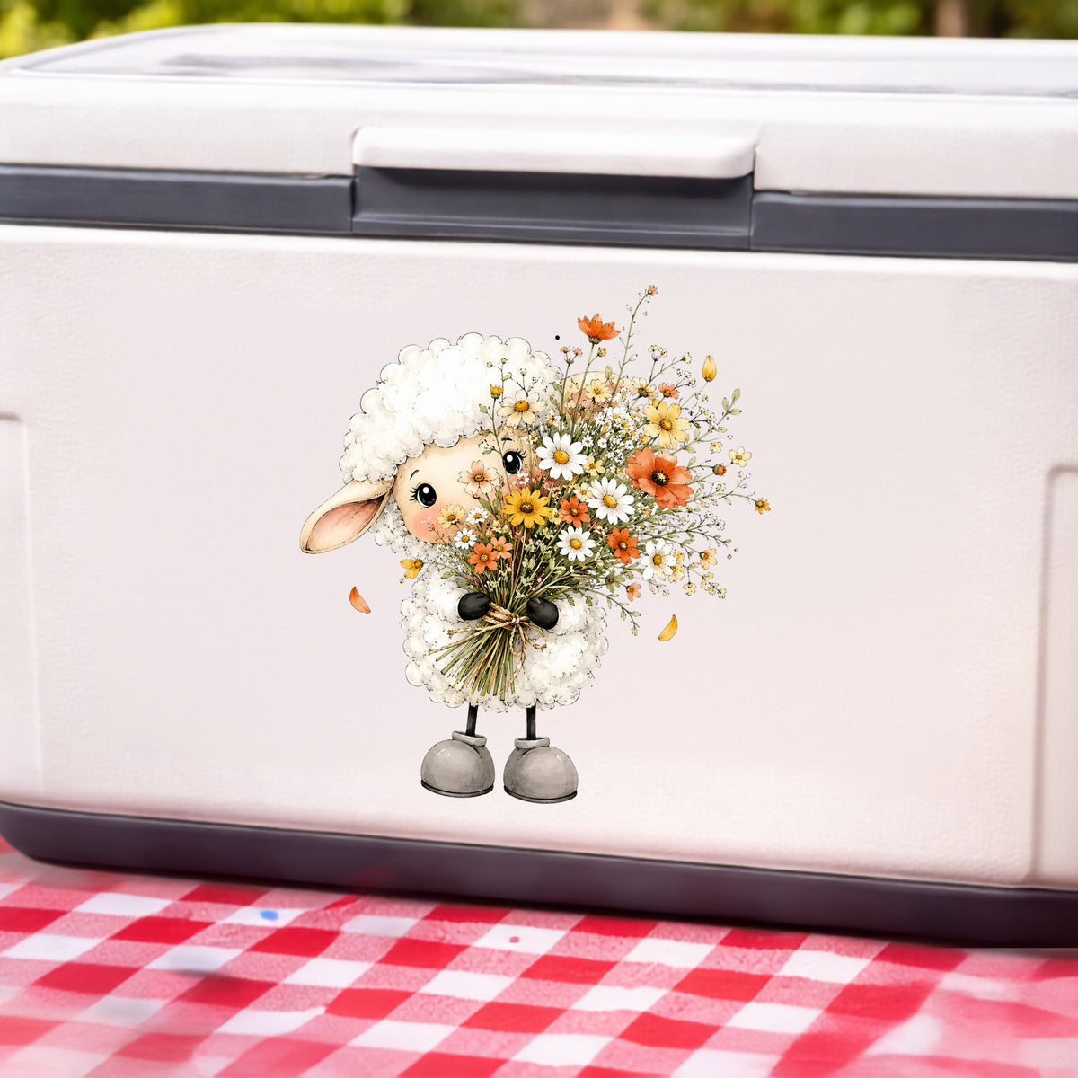 White Lamb Holding Wildflower Bouquet UV DTF sticker applied to a white cooler on a red gingham cloth