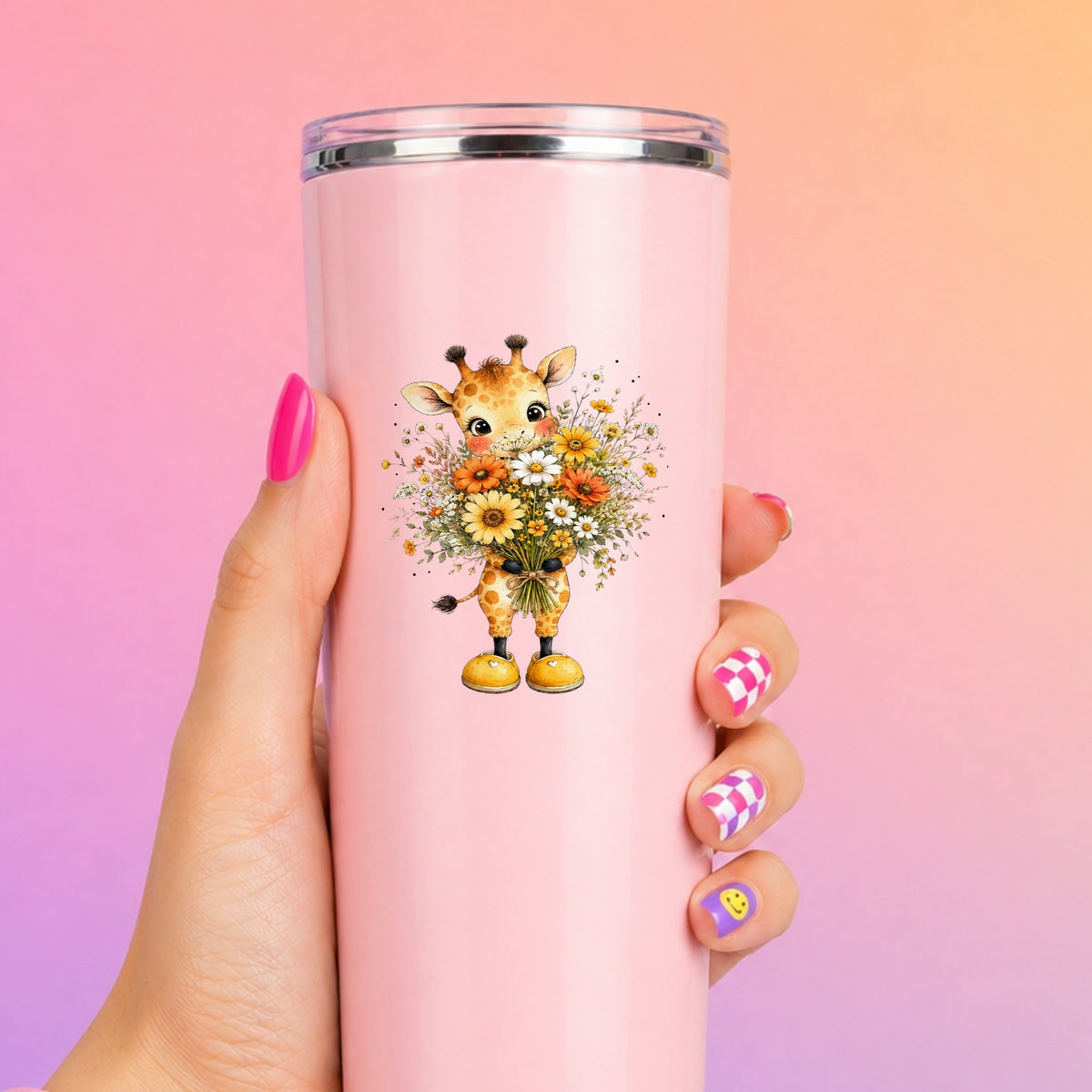 Watercolor Giraffe Holding Daisy Bouquet UV DTF sticker applied to a tall pink tumbler on a pink and orange background