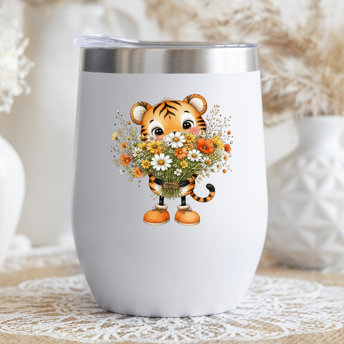 Tiger Cub Holding Wildflower Bouquet UV DTF sticker applied to a white stemless tumbler with a lid