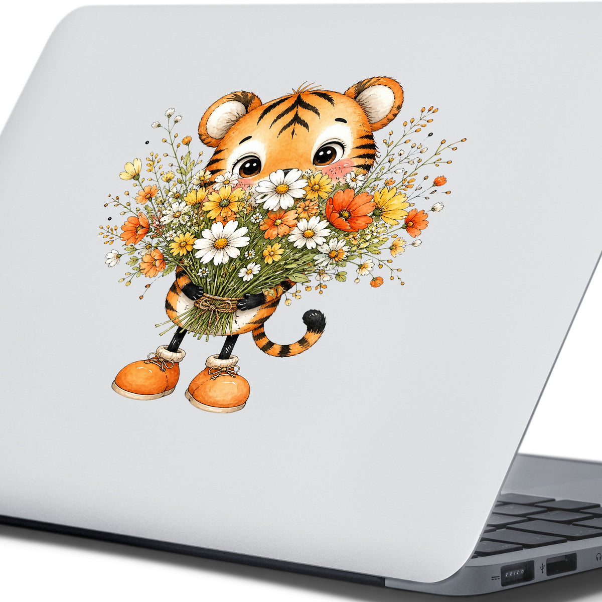 Tiger Cub Holding Wildflower Bouquet UV DTF sticker applied to the lid of a silver laptop