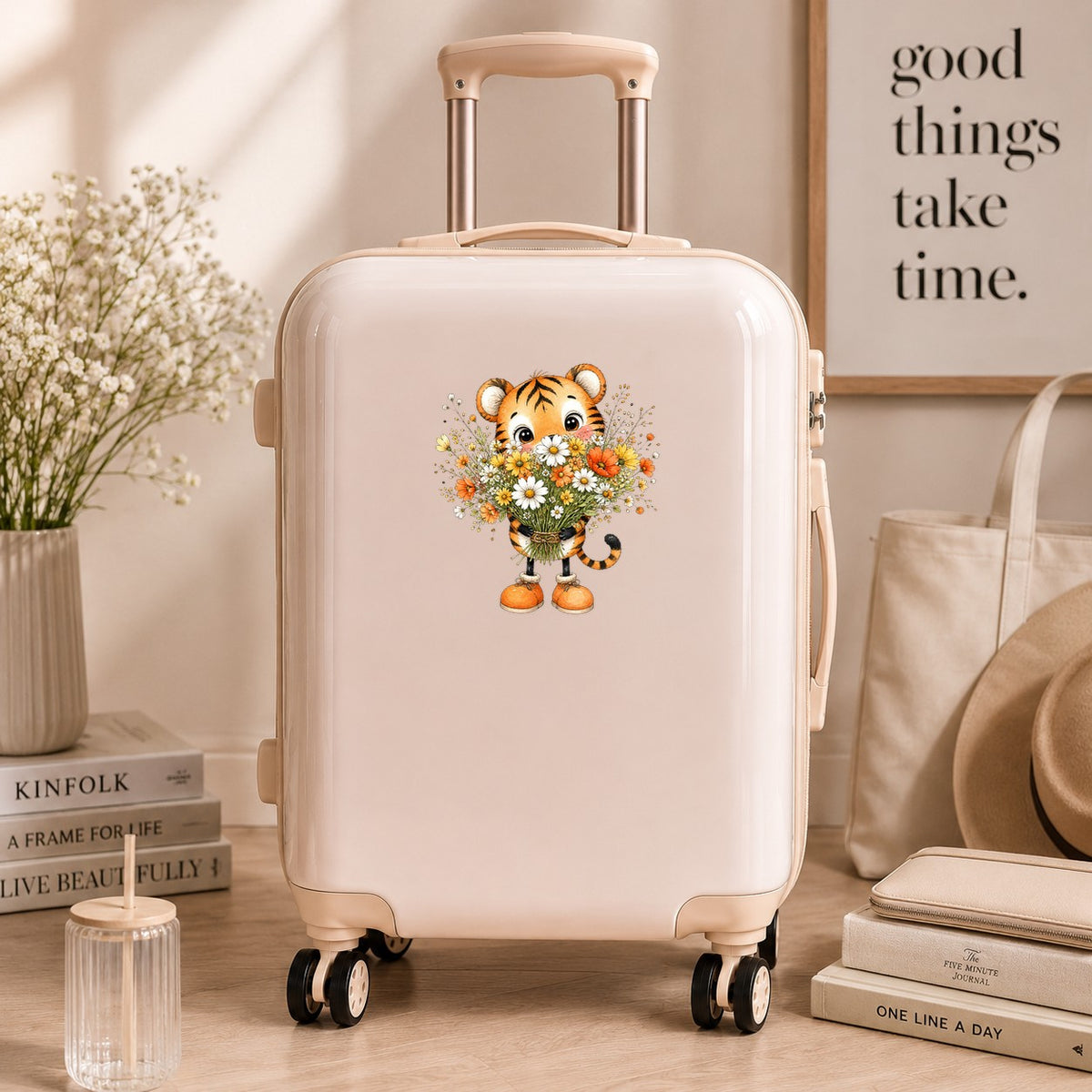 Tiger Cub Holding Wildflower Bouquet UV DTF sticker applied to a cream carry-on suitcase