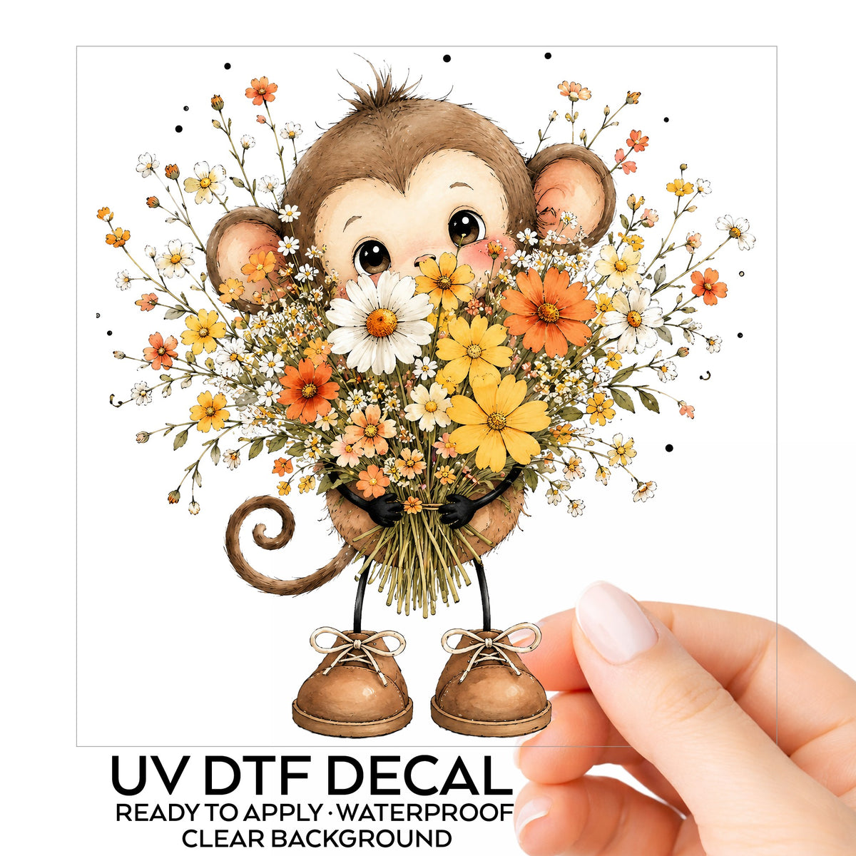 Baby Monkey Holding Daisy Bouquet UV DTF sticker on its backing card, held in hand
