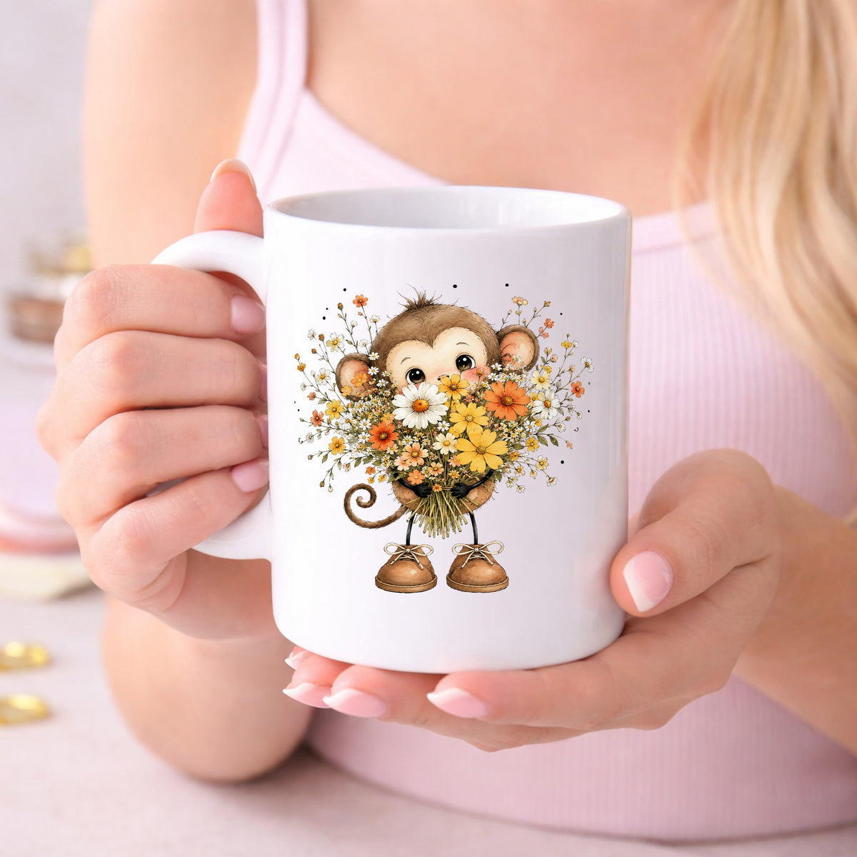 Baby Monkey Holding Daisy Bouquet UV DTF sticker applied to a white coffee mug held in both hands