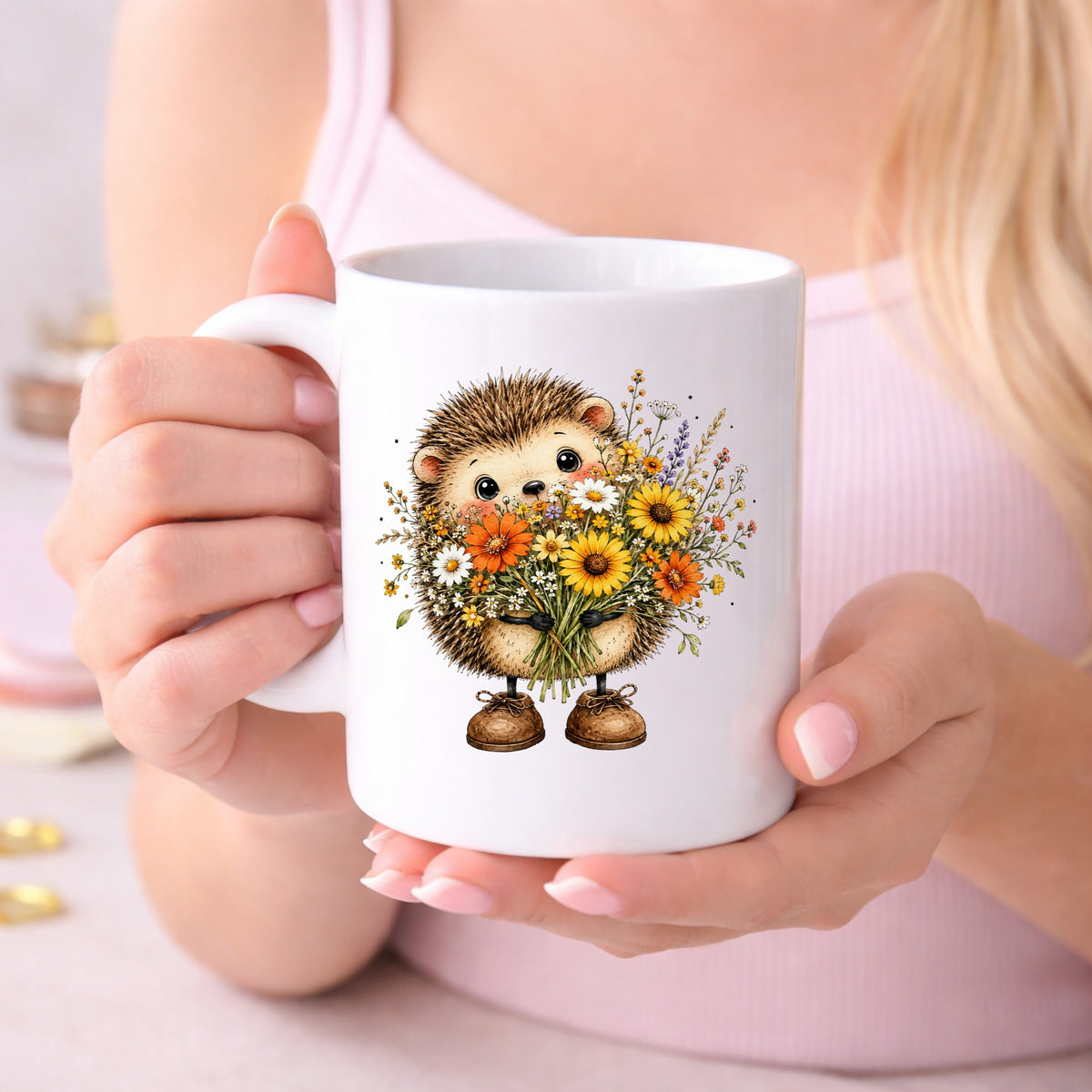Hedgehog Holding Wildflower Bouquet UV DTF sticker applied to a white coffee mug held in both hands