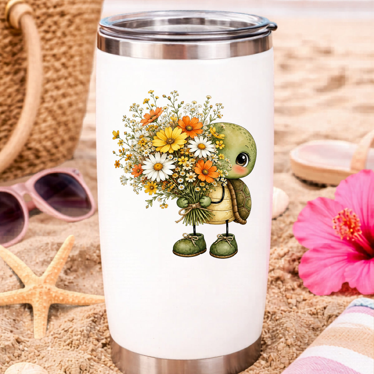 Baby Turtle Holding Wildflower Bouquet UV DTF sticker applied to a white travel tumbler on beach sand