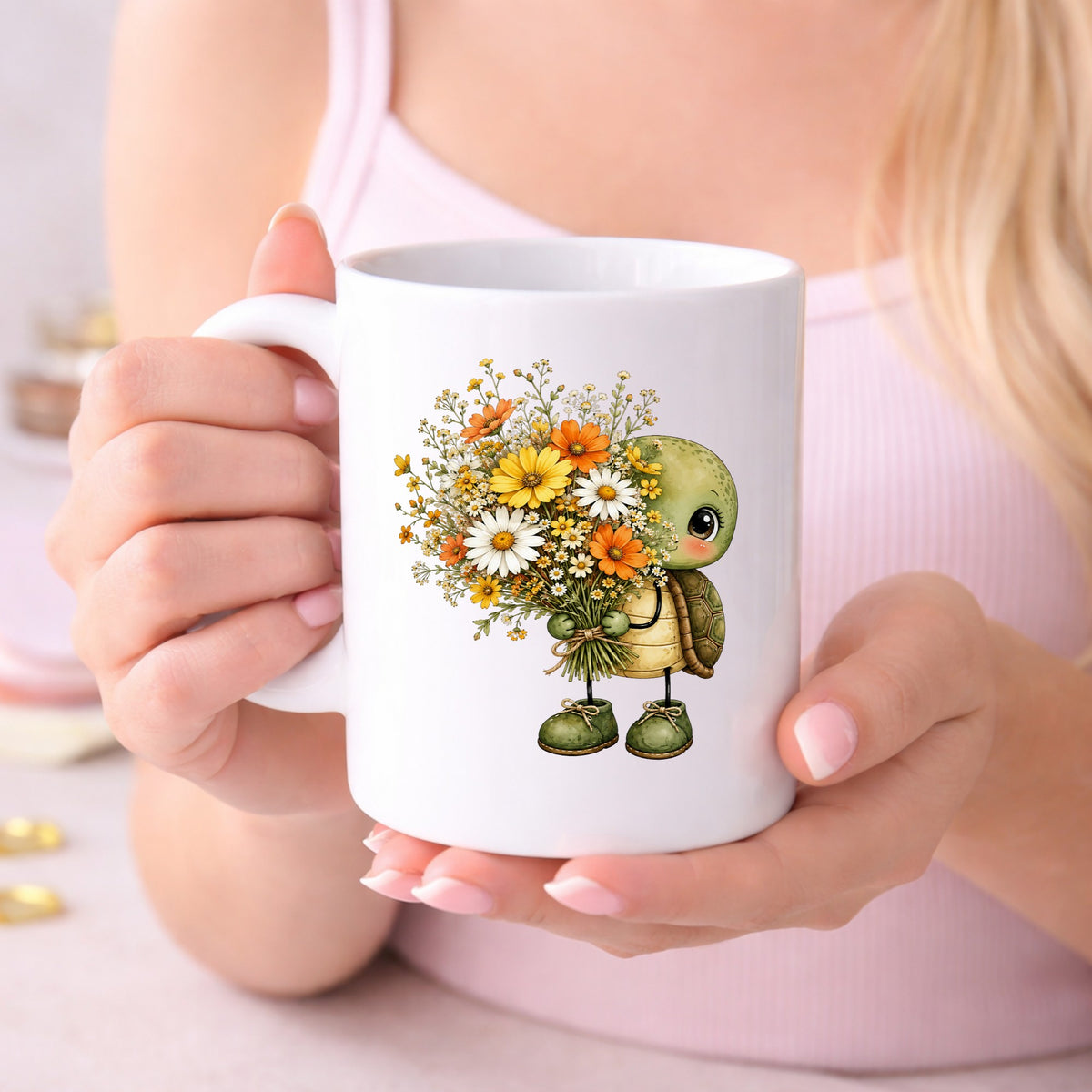 Baby Turtle Holding Wildflower Bouquet UV DTF sticker applied to a white coffee mug held in both hands