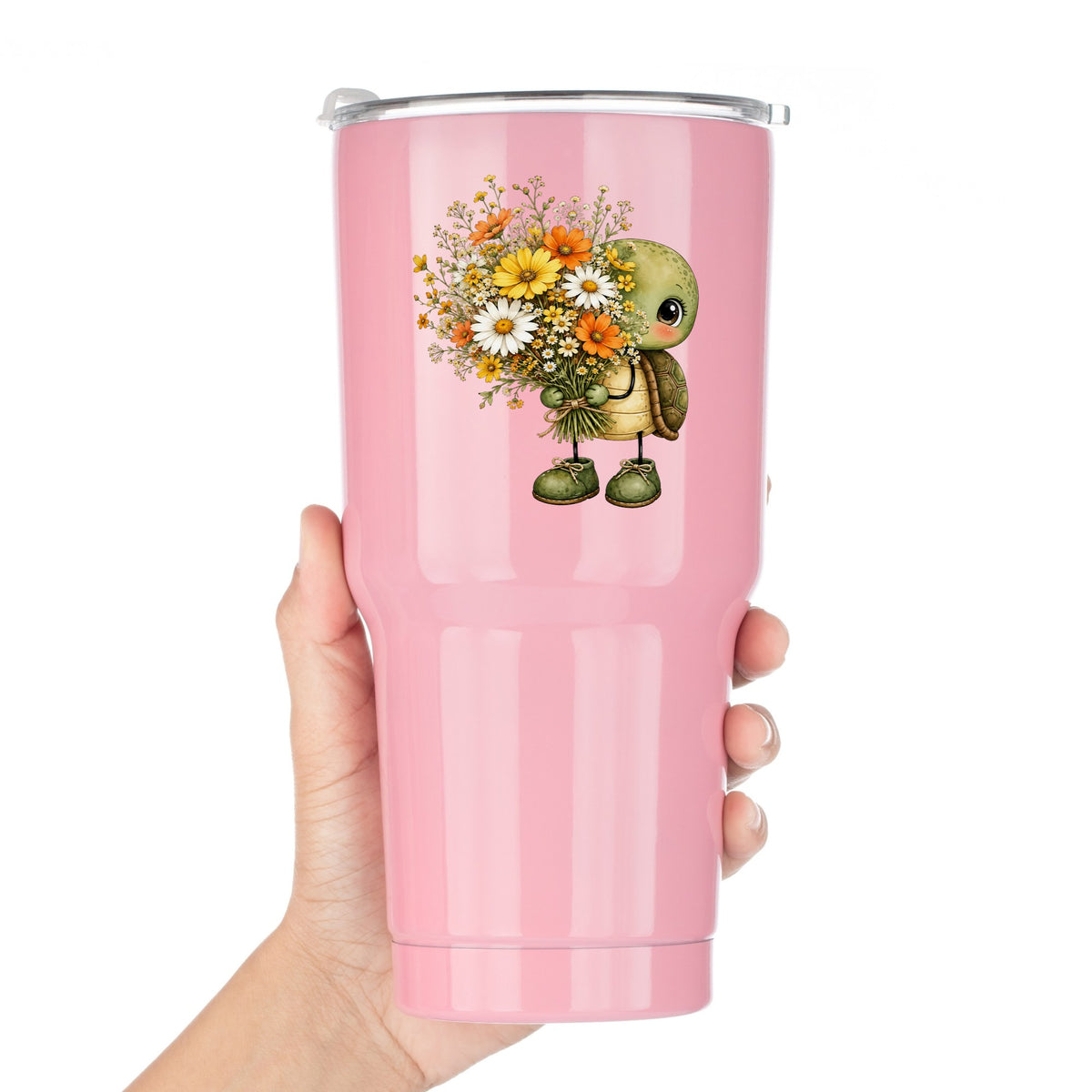 Baby Turtle Holding Wildflower Bouquet UV DTF sticker applied to a pink tumbler held against a white background