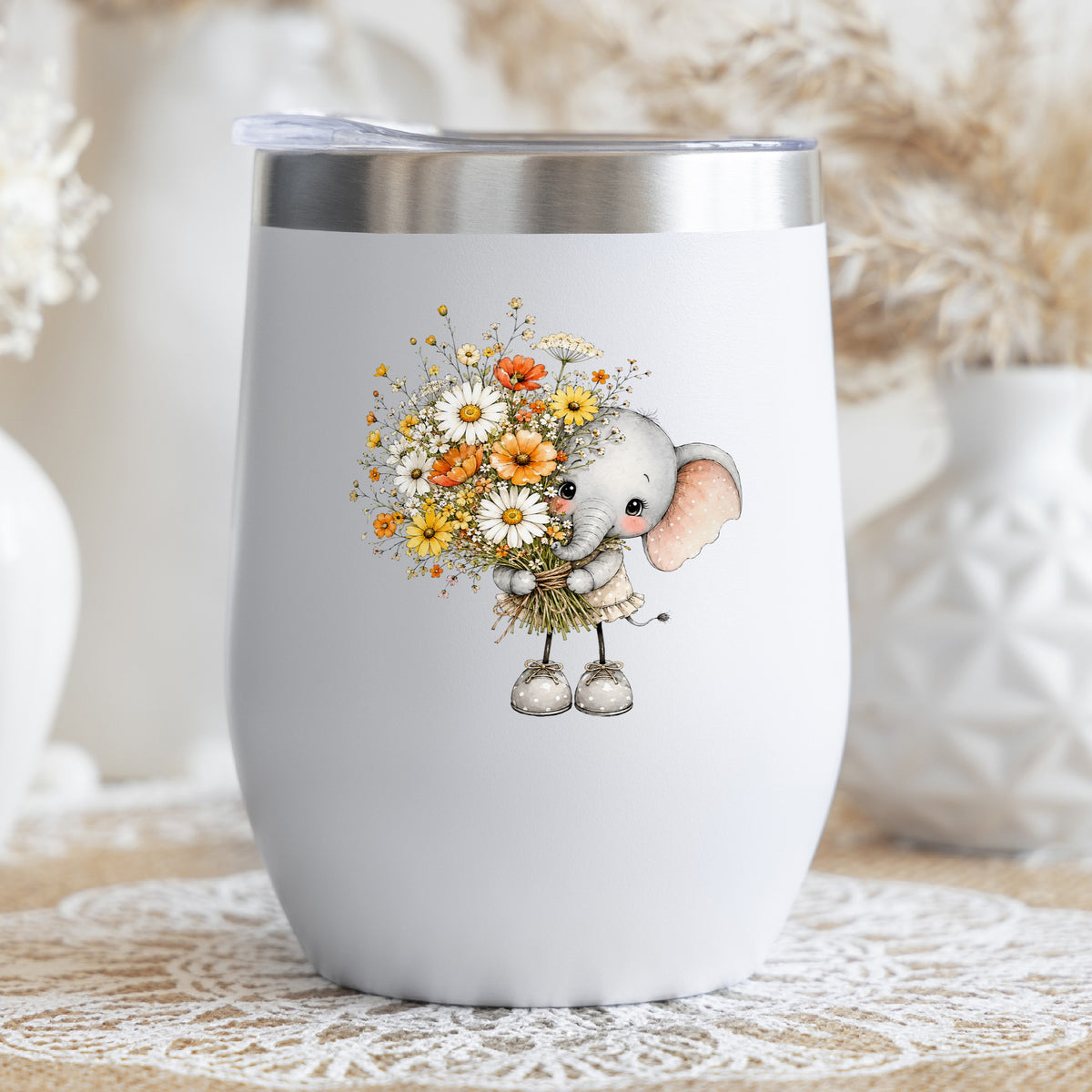 Baby Elephant Holding Daisy Bouquet UV DTF sticker applied to a white stemless tumbler with a lid