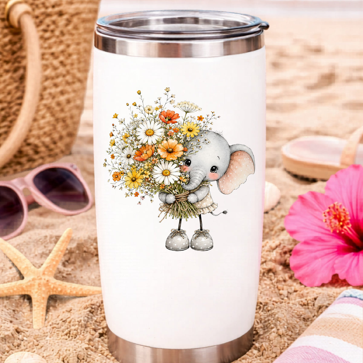 Baby Elephant Holding Daisy Bouquet UV DTF sticker applied to a white travel tumbler on beach sand