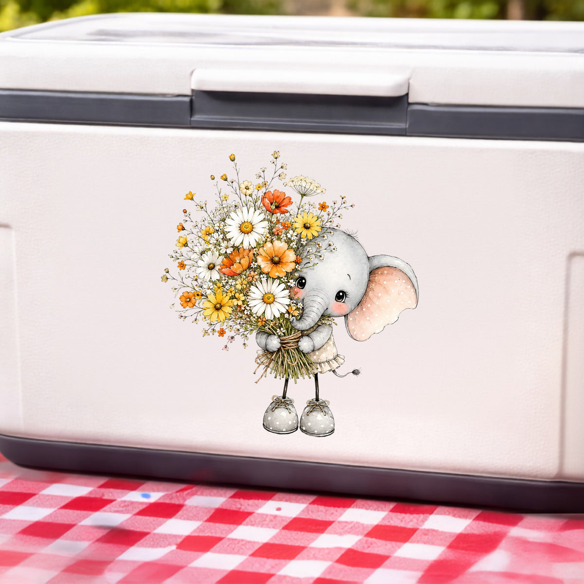 Baby Elephant Holding Daisy Bouquet UV DTF sticker applied to a white cooler on a red gingham cloth