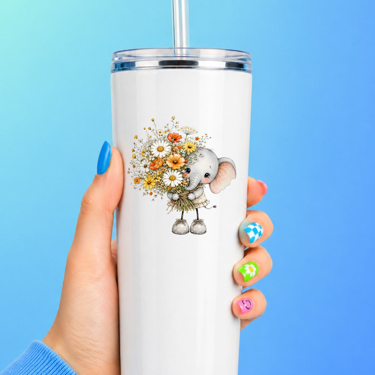 Baby Elephant Holding Daisy Bouquet UV DTF sticker applied to a white straw tumbler on a blue background