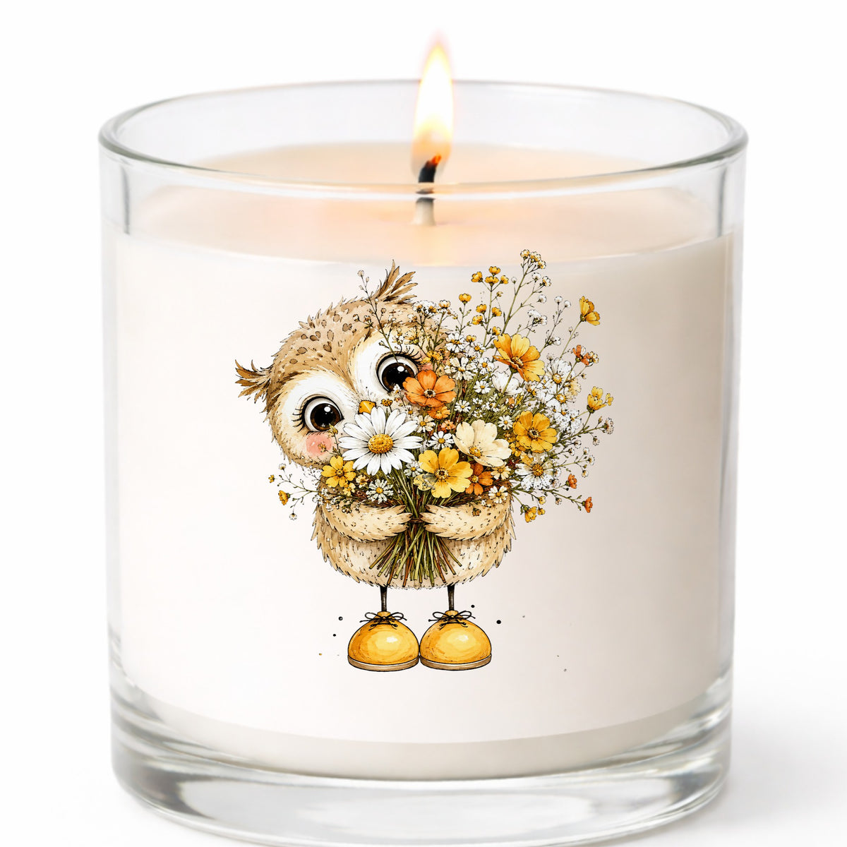 Baby Owl Holding Wildflower Bouquet UV DTF sticker applied to a white candle in a clear glass jar