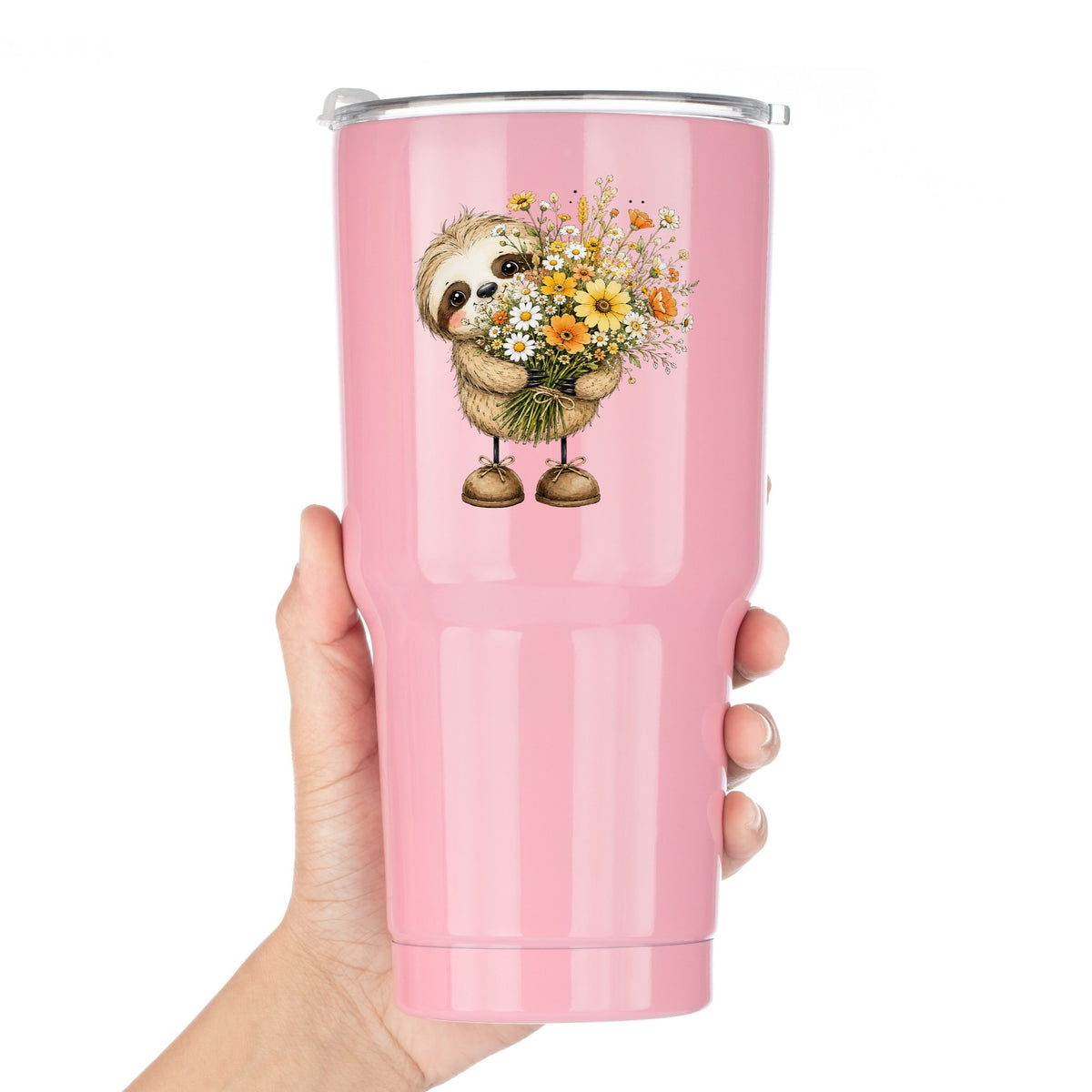 Baby Sloth Holding Wildflower Bouquet UV DTF sticker applied to a pink tumbler held against a white background