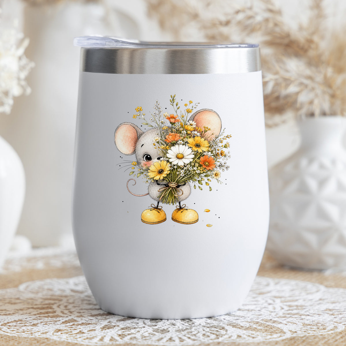 Little Mouse Holding Daisy Bouquet UV DTF sticker applied to a white stemless tumbler with a lid