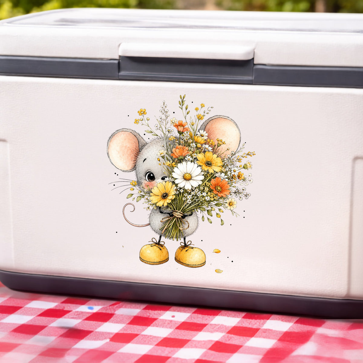 Little Mouse Holding Daisy Bouquet UV DTF sticker applied to a white cooler on a red gingham cloth