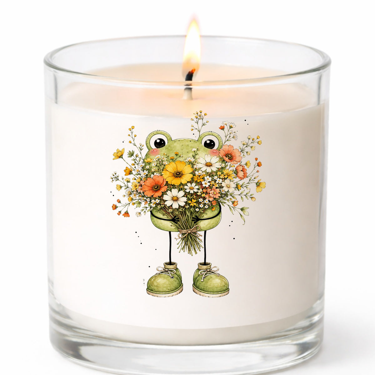 Green Frog Holding Wildflower Bouquet UV DTF sticker applied to a white candle in a clear glass jar