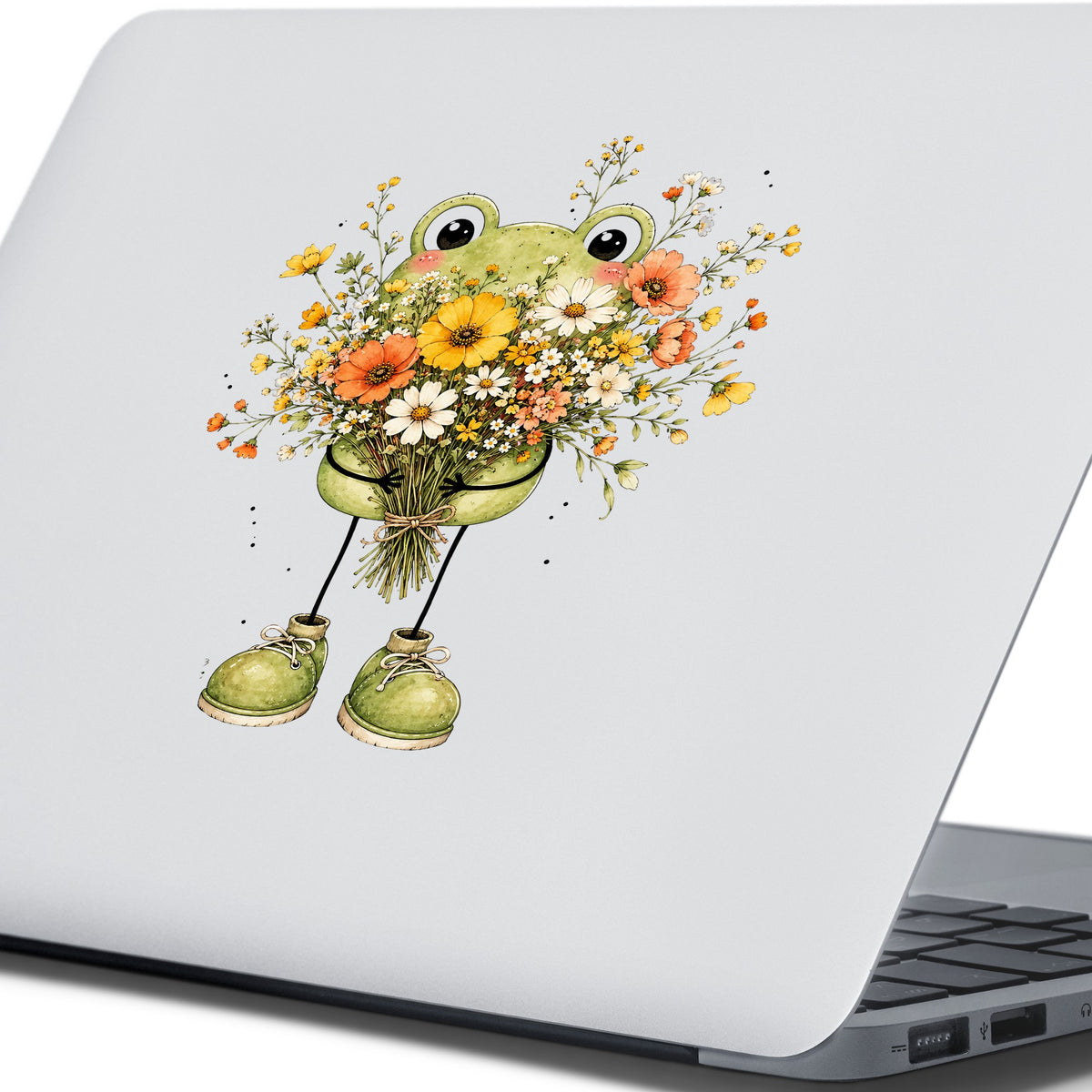 Green Frog Holding Wildflower Bouquet UV DTF sticker applied to the lid of a silver laptop