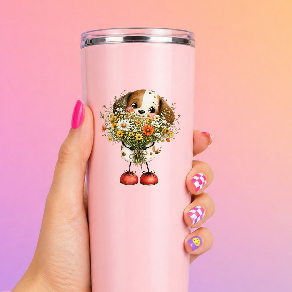 Brown Puppy Holding Daisy Bouquet UV DTF sticker applied to a tall pink tumbler on a pink and orange background
