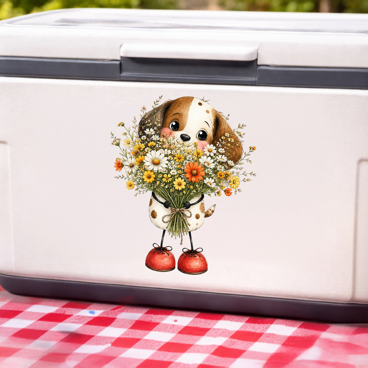 Brown Puppy Holding Daisy Bouquet UV DTF sticker applied to a white cooler on a red gingham cloth