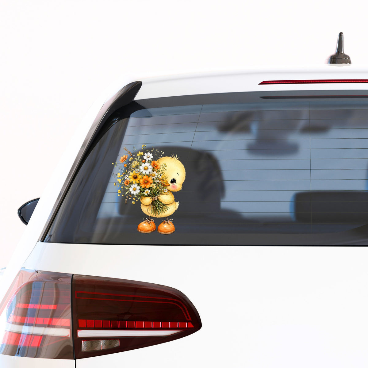 Yellow Duckling Holding Daisy Bouquet UV DTF sticker applied to the rear window of a white car