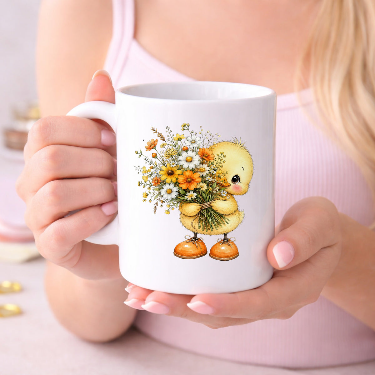 Yellow Duckling Holding Daisy Bouquet UV DTF sticker applied to a white coffee mug held in both hands