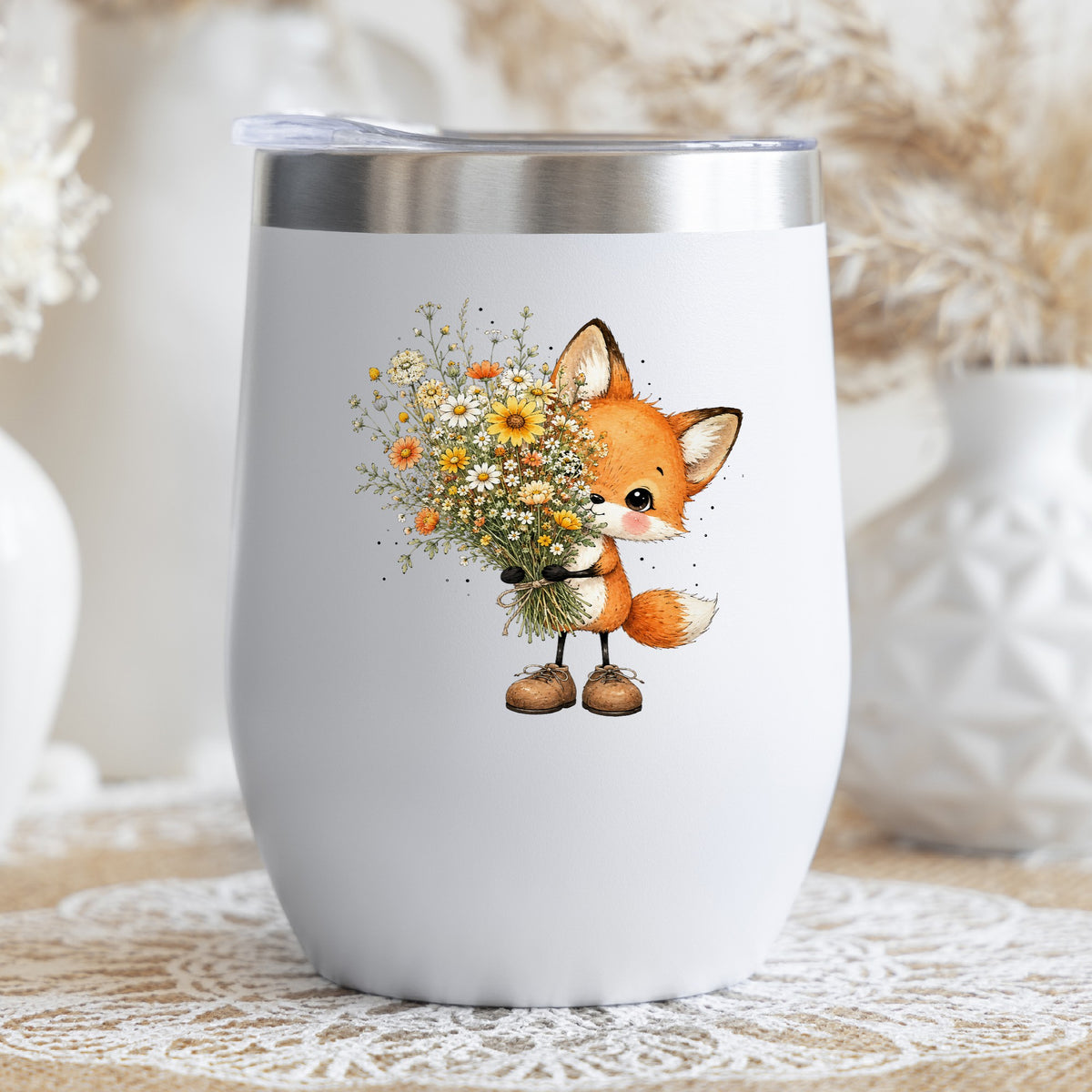 Baby Fox Holding Wildflower Bouquet UV DTF sticker applied to a white stemless tumbler with a lid