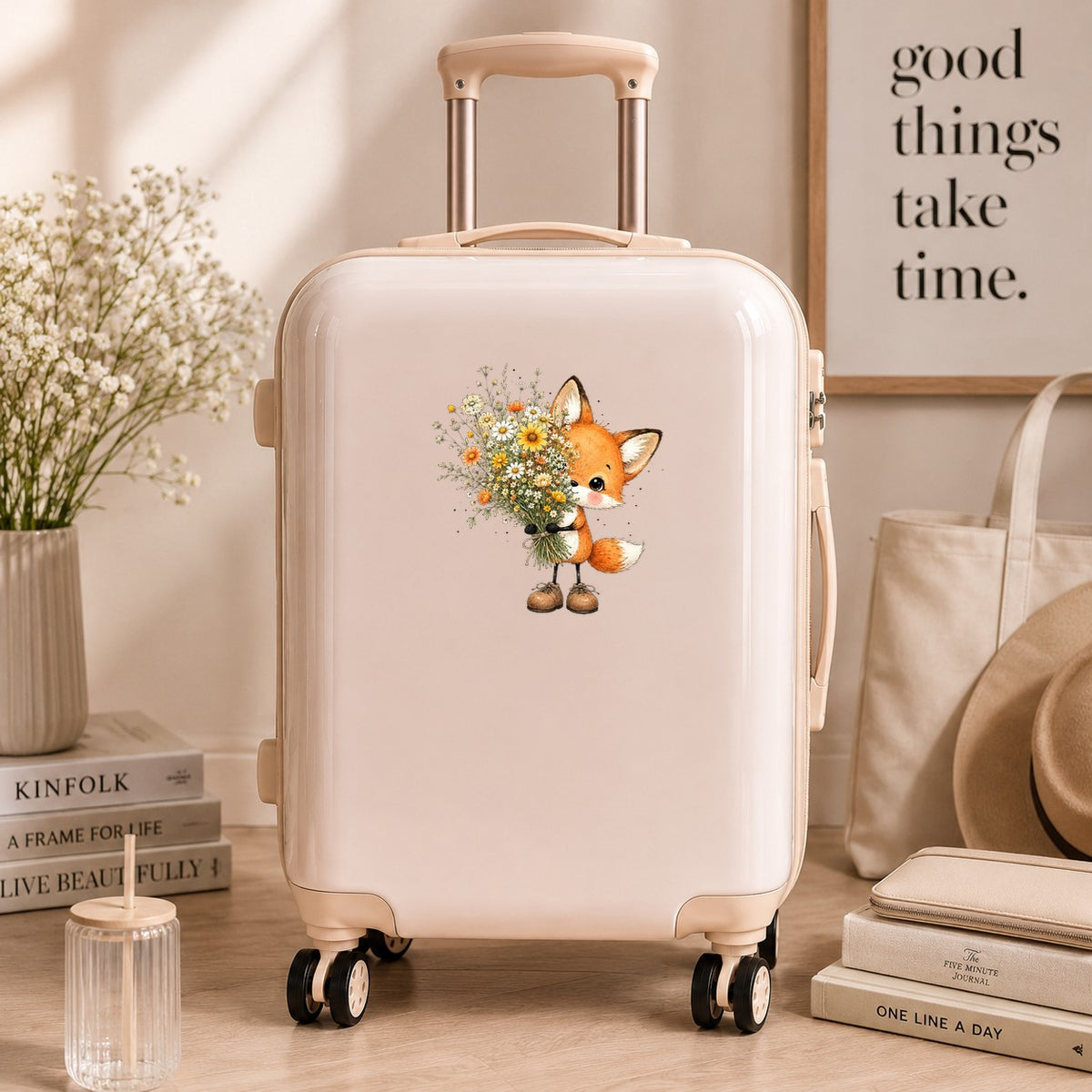Baby Fox Holding Wildflower Bouquet UV DTF sticker applied to a cream carry-on suitcase