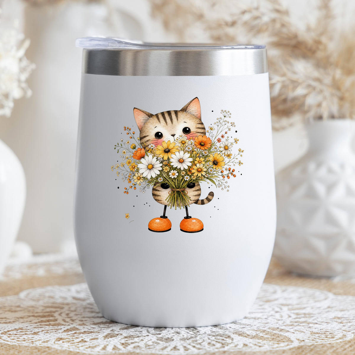Tabby Cat Holding Daisy Bouquet UV DTF sticker applied to a white stemless tumbler with a lid