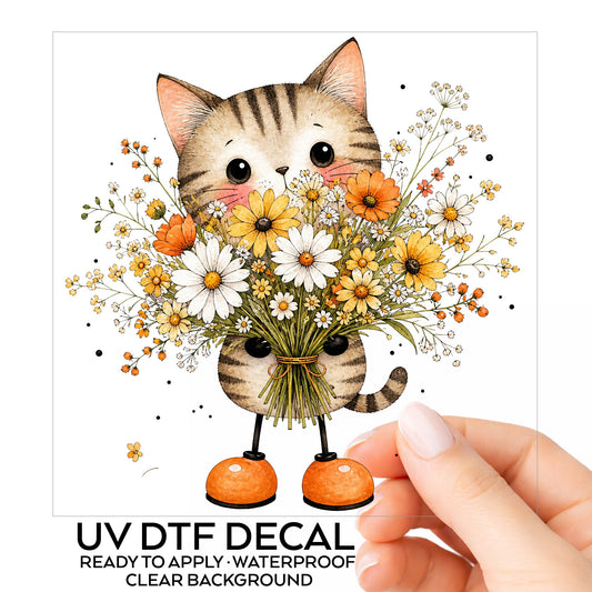 Tabby Cat Holding Daisy Bouquet UV DTF sticker on its backing card, held in hand