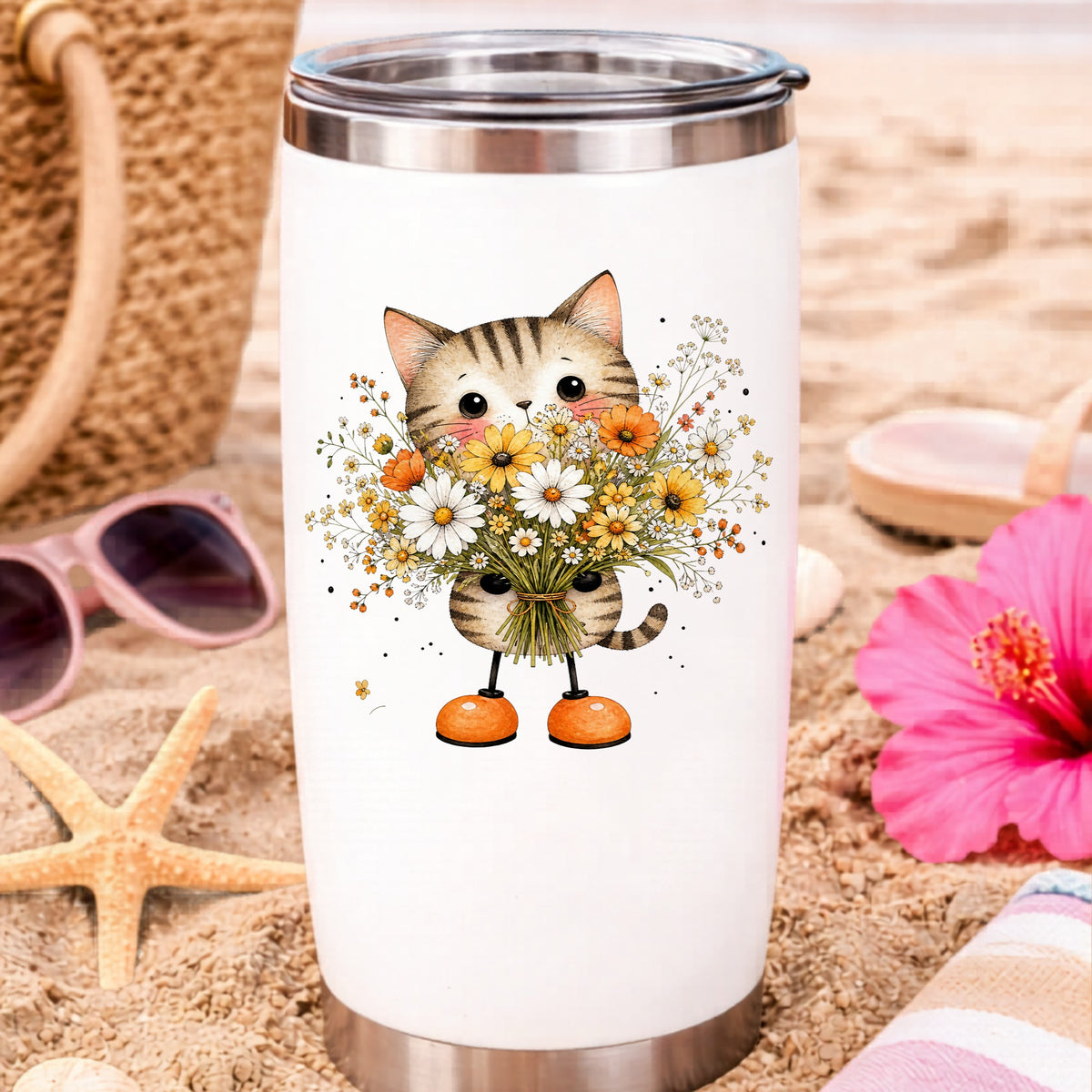 Tabby Cat Holding Daisy Bouquet UV DTF sticker applied to a white travel tumbler on beach sand