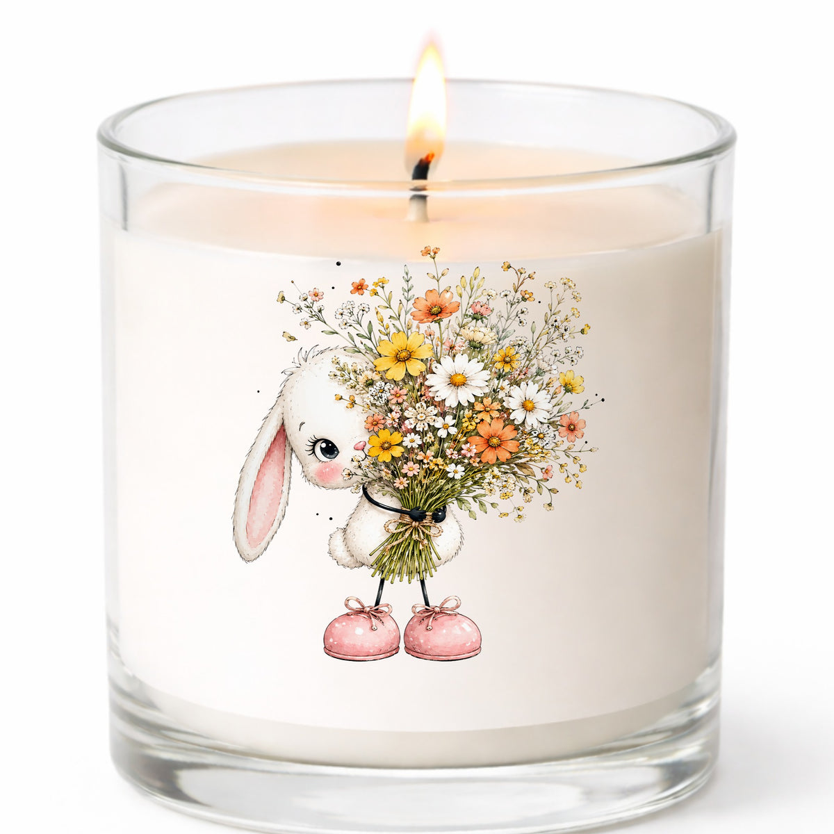 White Bunny Holding Wildflower Bouquet UV DTF sticker applied to a white candle in a clear glass jar