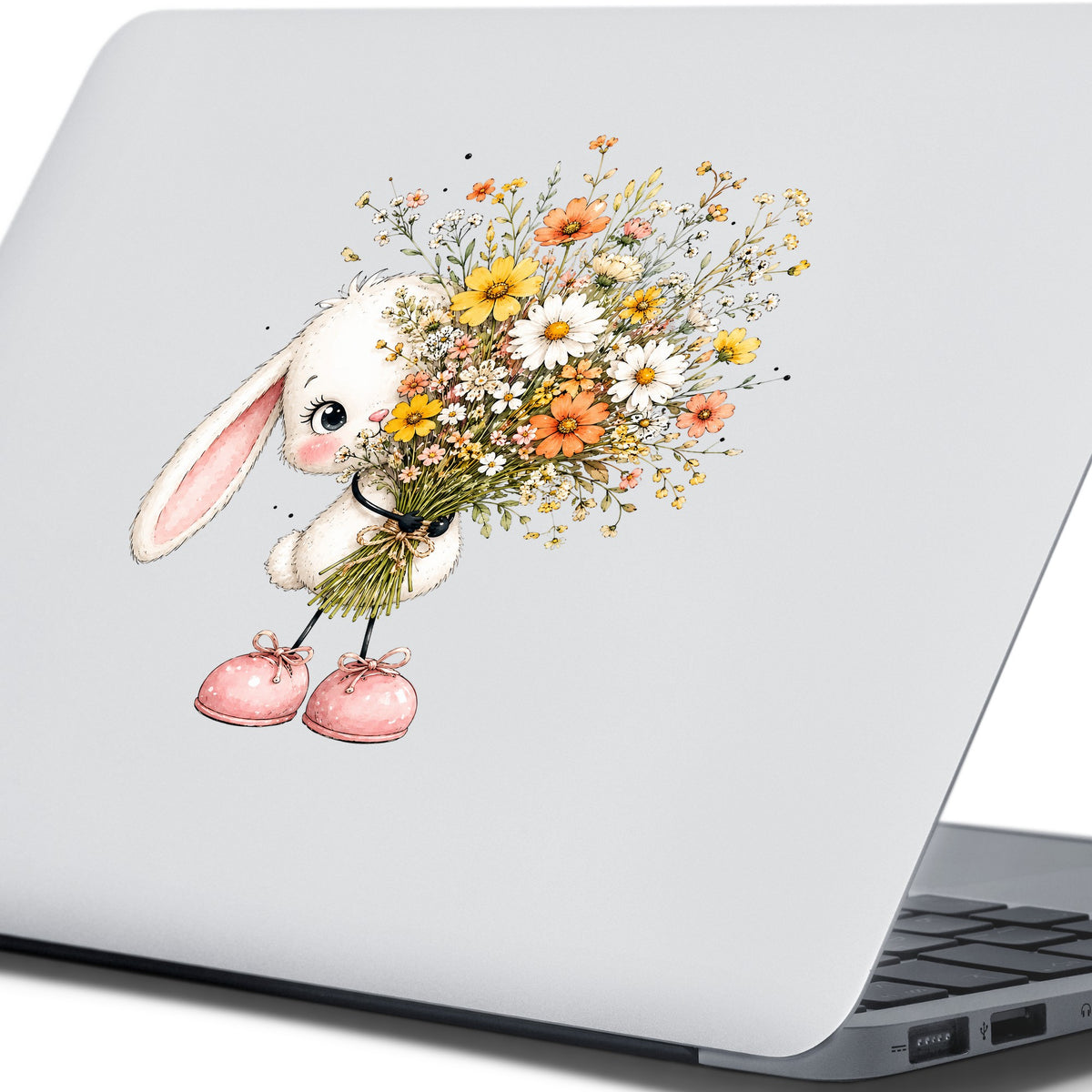 White Bunny Holding Wildflower Bouquet UV DTF sticker applied to the lid of a silver laptop