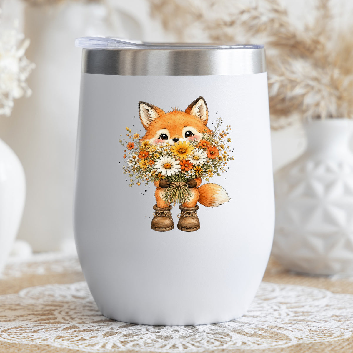Watercolor Fox Holding Daisy Bouquet UV DTF sticker applied to a white stemless tumbler with a lid