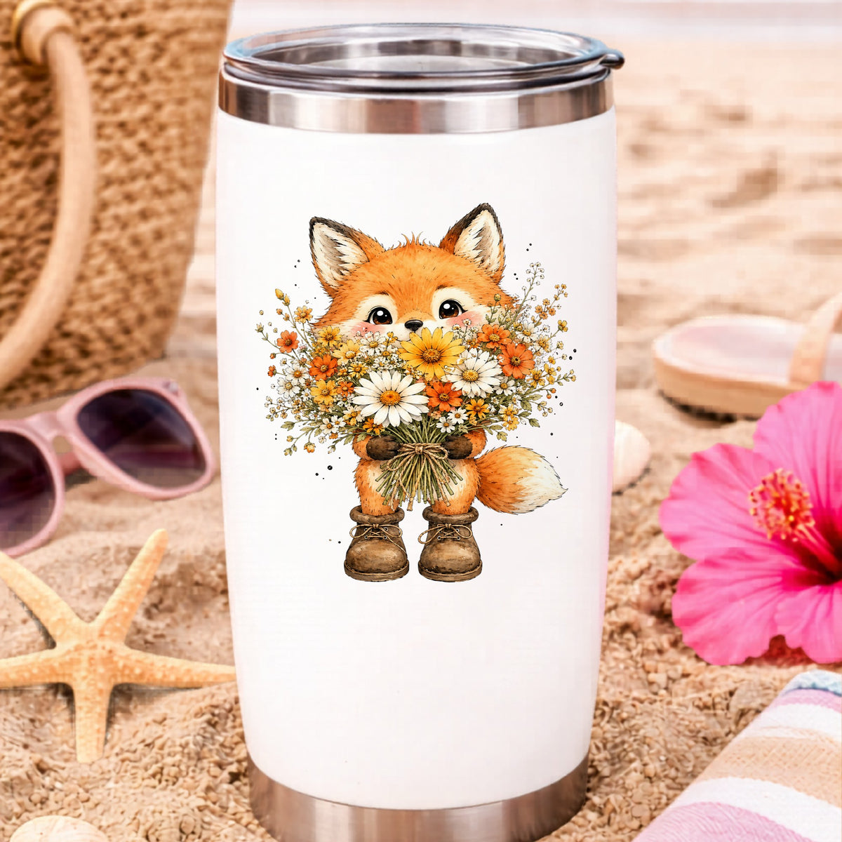 Watercolor Fox Holding Daisy Bouquet UV DTF sticker applied to a white travel tumbler on beach sand