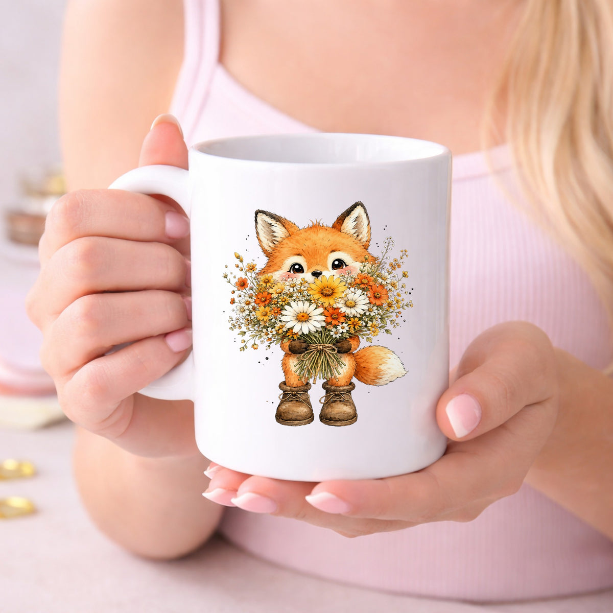 Watercolor Fox Holding Daisy Bouquet UV DTF sticker applied to a white coffee mug held in both hands